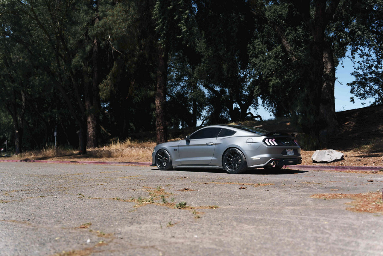 2019 Ford Mustang on black staggered TSW Imola wheels